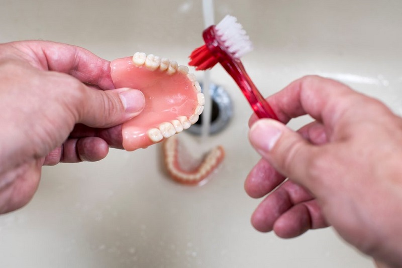 Should You Keep Dentures in Water Overnight?